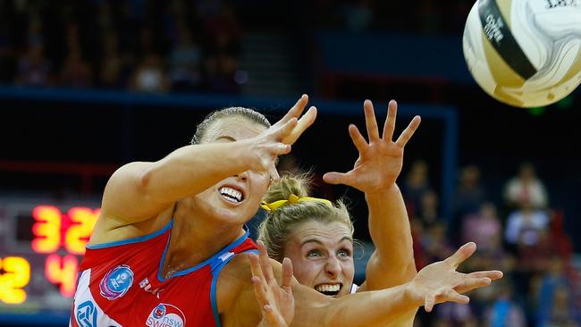 Gabi Simpson of the Firebirds competes for the ball with Kimberlee Green of the Swifts.