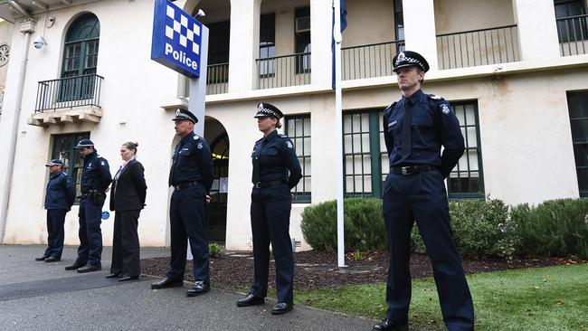 A guard of honour is formed by members of the South Melbourne Victoria Police Station in honour of their colleagues. Picture: AAP Image/James Ross