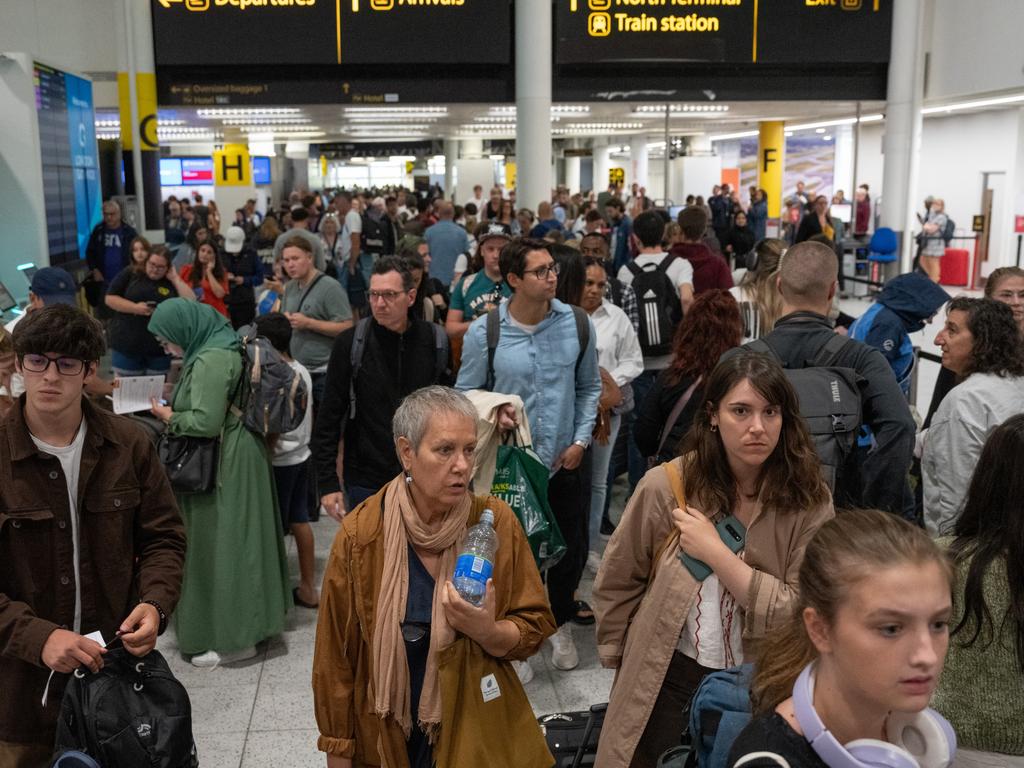 People wait near check-in desks at Gatwick Airport in Crawley, United Kingdom. Picture: Getty Images