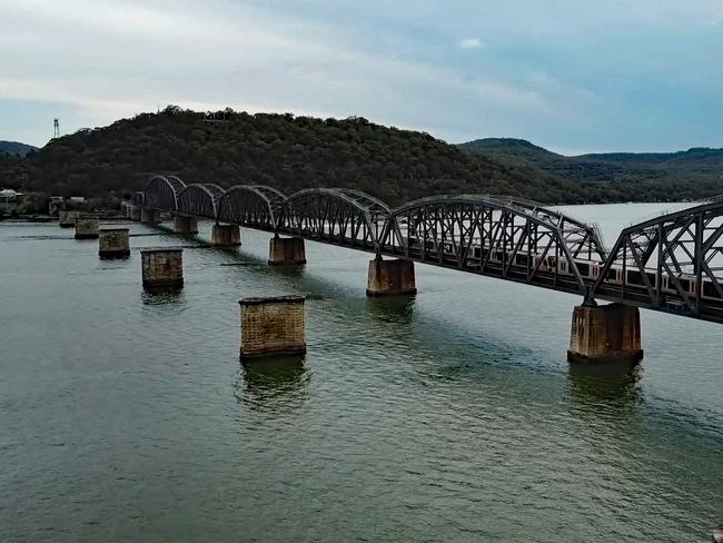 The old sandstone pylons still sand next to the current rail bridge, a silent testament to the nearby quarry. Picture: Mitchell Hubbard.