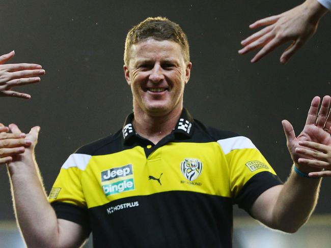 MELBOURNE, VICTORIA - APRIL 24:  Tigers head coach Damien Hardwick celebrates the win with fans during the round five AFL match between the Richmond Tigers and the Melbourne Demons at Melbourne Cricket Ground on April 24, 2017 in Melbourne, Australia.  (Photo by Michael Dodge/AFL Media/Getty Images)