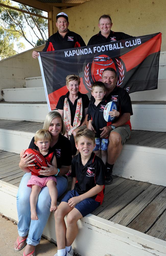 FAMILY’S TIES: From left back, Sam Ryan and Matt Ryan, parents Sue and Terry with Sam’s sons Archie, 4, and Jack, 8, front, and daughter Emma Valentine holding son Eddie, 2. Picture: Mark Brake