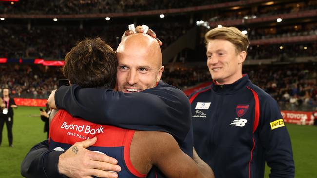 Nathan Jones hugs Kysaiah Pickett after the Dees win over Geelong. Picture: Michael Klein