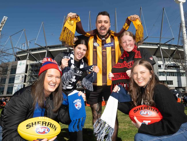 Melbourne based Footy Fans outside the MCG. Possibly finals contenders. L-R Maddie Barras (22)  Bulldogs, Sophia Bezzina (15) Carlton, Dimitri Marras (26) Hawthorn, Lucy Martin (14)  Essendon, Laura Petrie (27)  Geelong  Picture: Tony Gough