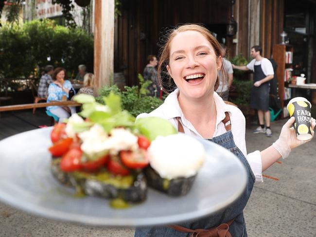 Farm House's Georgia Perry with a plate of food at the Kedron store. Pic Peter Wallis