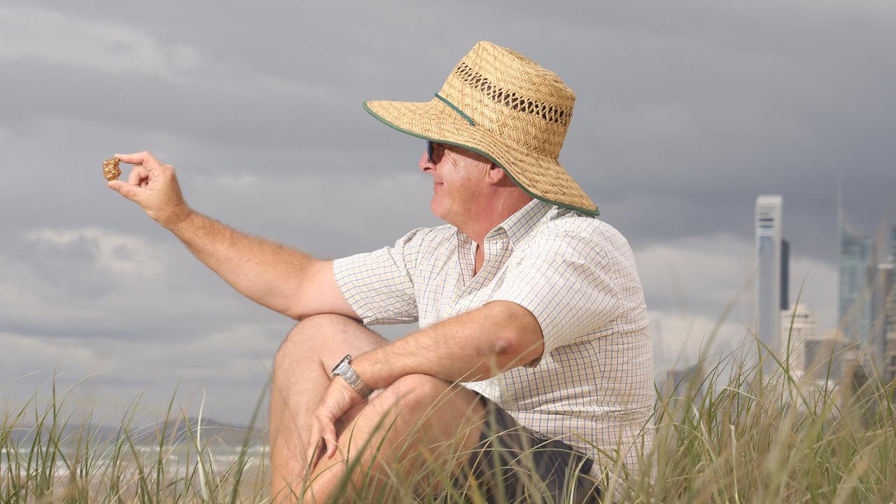 Greg Cooke has three gold nuggets he says he found on a Gold Coast Beach — but exactly where is top secret. Picture: Scott Fletcher