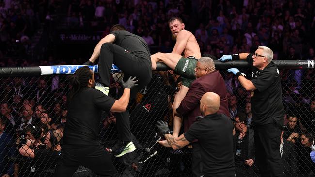 Conor McGregor attempts to leave the octagon in chase of Khabib Nurmagomedov. Picture: Zuffa LLC