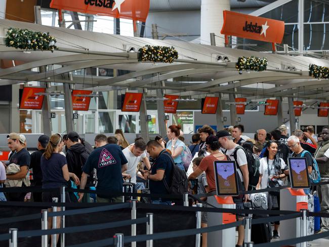 WEEKEND TELEGRAPHS. CHECK WITH PIC EDITOR JEFF DARMANIN BEFORE USE. People queue for check in at the Jetstar counter at Sydney Domestic Airport, on what is historically one of the busiest days of the year at SydneyÃs airports. Pic shows . Friday 15/12/2023. Picture by Max Mason-Hubers