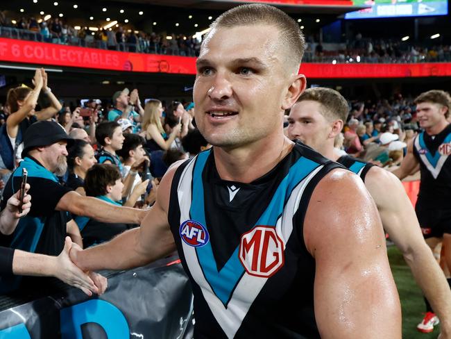 ADELAIDE, AUSTRALIA - APRIL 13: Ollie Wines of the Power celebrates with fans during the 2025 AFL Round 05 match between the Port Adelaide Power and the Hawthorn Hawks at Adelaide Oval on April 13, 2025 in Adelaide, Australia. (Photo by Michael Willson/AFL Photos via Getty Images)
