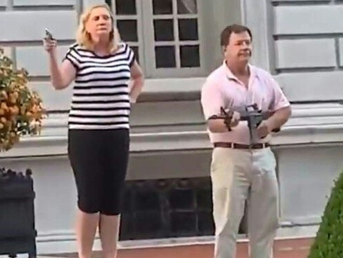 Mark and Patricia McCloskey brandish guns at BLM protesters. Picture; AFP.