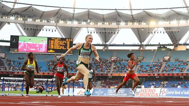 Australia's Sally Pearson wins the gold medal crossing the line first in the Women's 100m Hurdles Final at Jawaharlal Nehru Stadium during the 2010 Delhi Commonwealth Games.