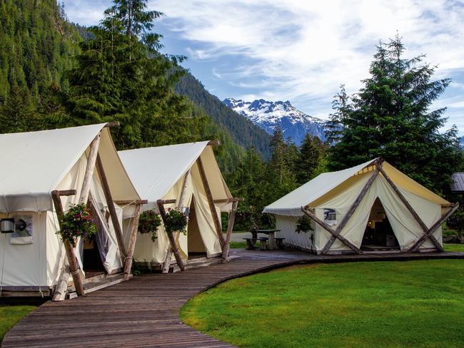 EMBARGO FOR TRAVEL + LUXURY MAGAZINE 16 DECEMBER 2022. Canada. Man vs Wild. PHOTOGRAPHY BY Nikki Fenix. WORDS BY George Epaminondas. Ask permission to reuse images. A cedar boardwalk connects the lodge’s tents, including these common spaces.