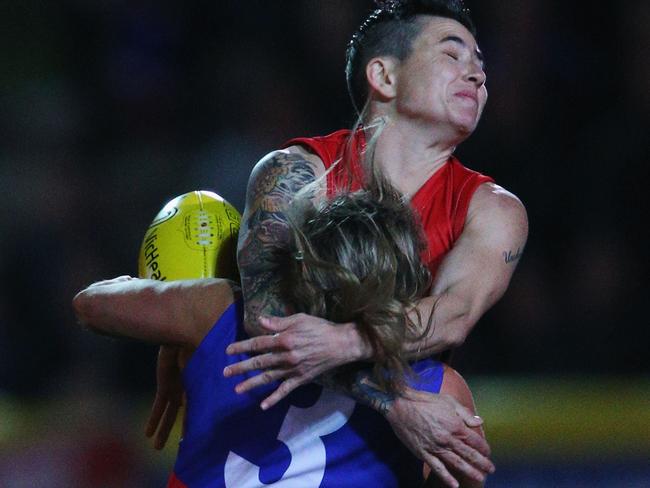 Katie Brennan is tackled by Ceceila MacIntosh.