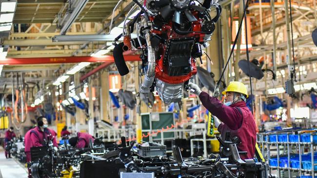 Employees work on a vehicle assembly line at a JAC Automotive factory in Qingzhou, in China's eastern Shandong province. Picture: AFP / China OUT