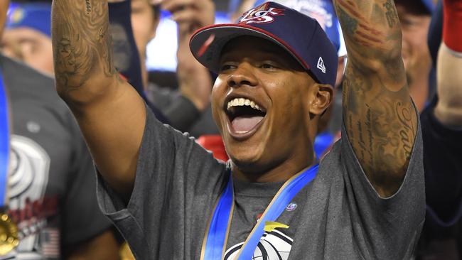 U.S. pitcher Marcus Stroman celebrates with the MVP trophy after the team's 8-0 win over Puerto Rico in the final of the World Baseball Classic.