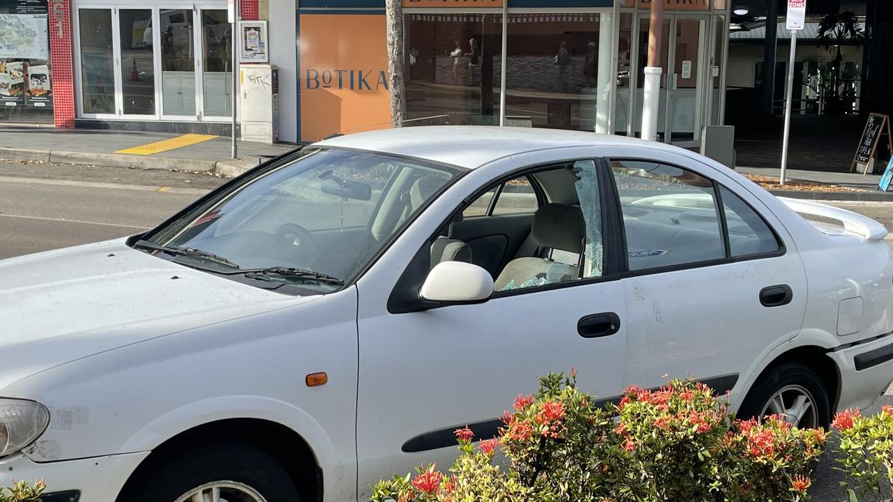 Windows of a vehicle shot out when police were forced to open fire on a man who rushed at them while armed with a knife on the main street of Airlie Beach. Picture: Janessa Ekert