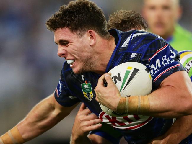 SYDNEY, AUSTRALIA - APRIL 29:  Adam Elliot of the Bulldogs is tackled during the round nine NRL match between the Canterbury Bulldogs and the Canberra Raiders at ANZ Stadium on April 29, 2017 in Sydney, Australia.  (Photo by Matt King/Getty Images)