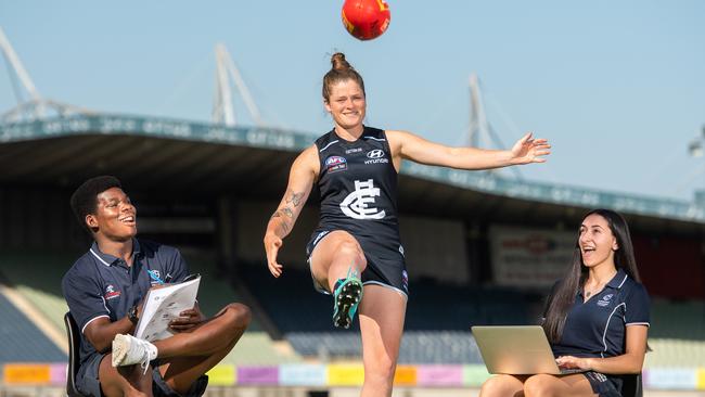 Carlton AFLW captain Brianna Davey with students Pemi Akin Ojelab and Natasha Versace. Picture: Jason Edwards.