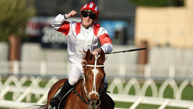 Reece Jones celebrates his first Group 1 win aboard Land Legend in The Metropolitan at Randwick. Picture: Jeremy Ng/Getty Images