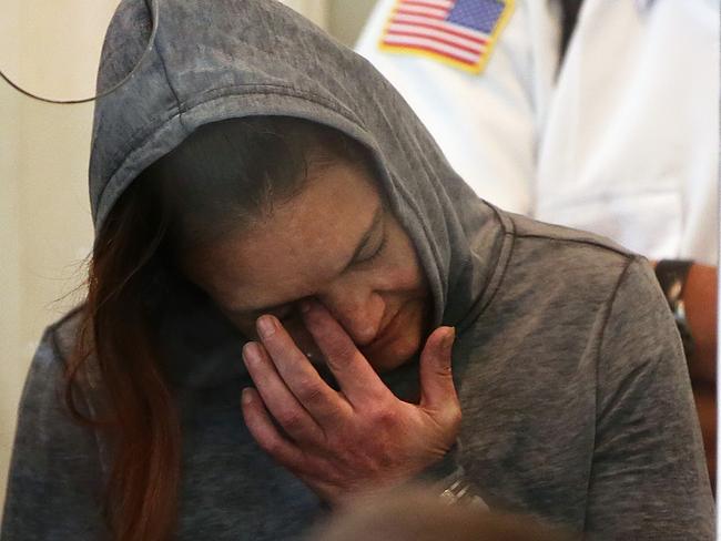 Rachelle Bond wipes her eye as she is arraigned on charges of acting after the fact in helping to dispose of the body of her daughter. Picture: Pat Greenhouse