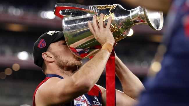 Michael Hibberd drinks from the premiership cup.