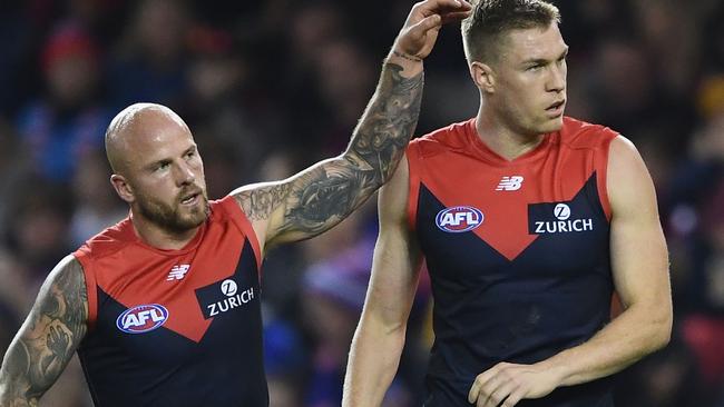 Nathan Jones congratulates Tom McDonald after one of his four goals.