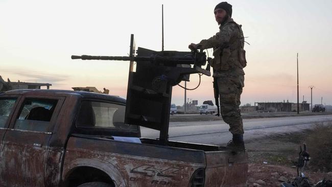 An anti-regime fighter mans a gun on the outskirts of Aleppo. Picture: AFP