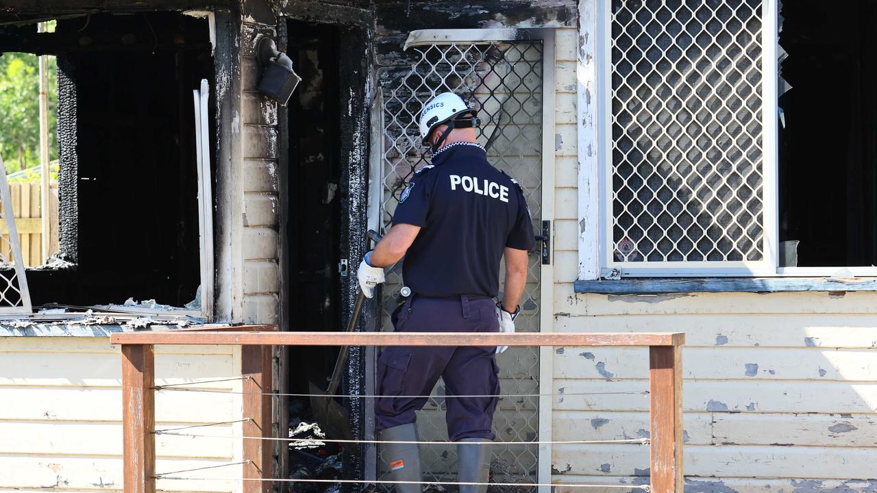 A police investigator enters the home. Picture: Tertius Pickard