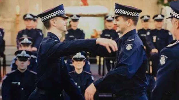 Josh Prestney (left) with his brother Alex at his graduation from police college. Prestney was killed, along with three other Victorian police officers, when they were hit by a truck on a Melbourne freeway. Photograph: Victoria police