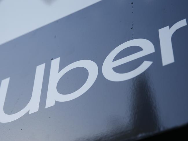 LONDON, ENGLAND - MARCH 17: A general view of the Uber Boat logo in view of the City of London skyline on March 17, 2021 in London, England. Uber has agreed to classify its British drivers as workers. (Photo by Hollie Adams/Getty Images)