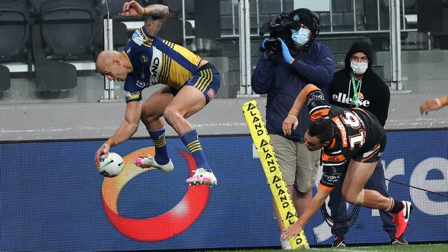 Parramatta’s Blake Ferguson takes to the air to cross the line against Wests Tigers but the try was disallowed due to an earlier knock-on. Picture: Phil Hillyard