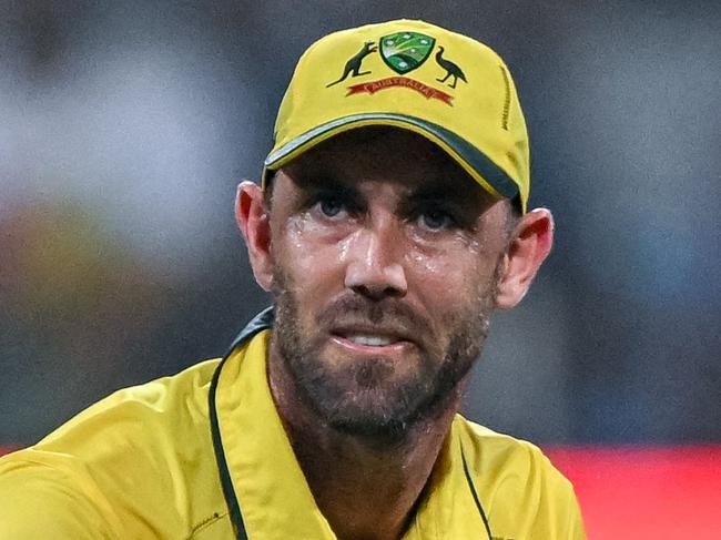 Australia's Glenn Maxwell stretches during the 2023 ICC Men's Cricket World Cup one-day international (ODI) match between Australia and Afghanistan at the Wankhede Stadium in Mumbai on November 7, 2023. (Photo by INDRANIL MUKHERJEE / AFP) / -- IMAGE RESTRICTED TO EDITORIAL USE - STRICTLY NO COMMERCIAL USE --