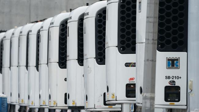 Refrigeration trucks used as temporary morgues are parked outside of Bellevue Hospital in April in New York. Picture: Bryan R. Smith/AFP)