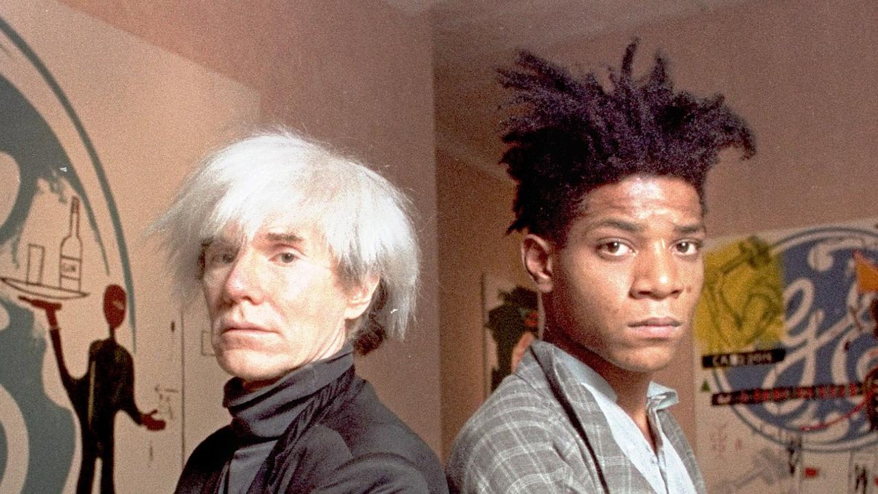 Jean-Michel Basquiat (right) with fellow art icon Andy Warhol in 1985.