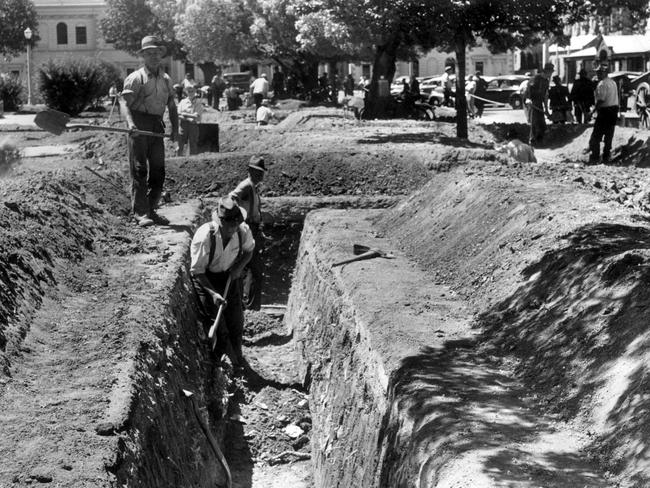 Volunteers dig air raid shelters in Victoria Square, in 1942.