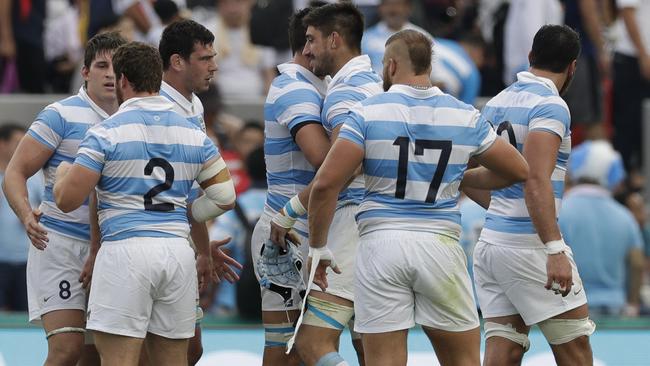 Argentina players celebrate their win over Tonga on Saturday. Picture: AP