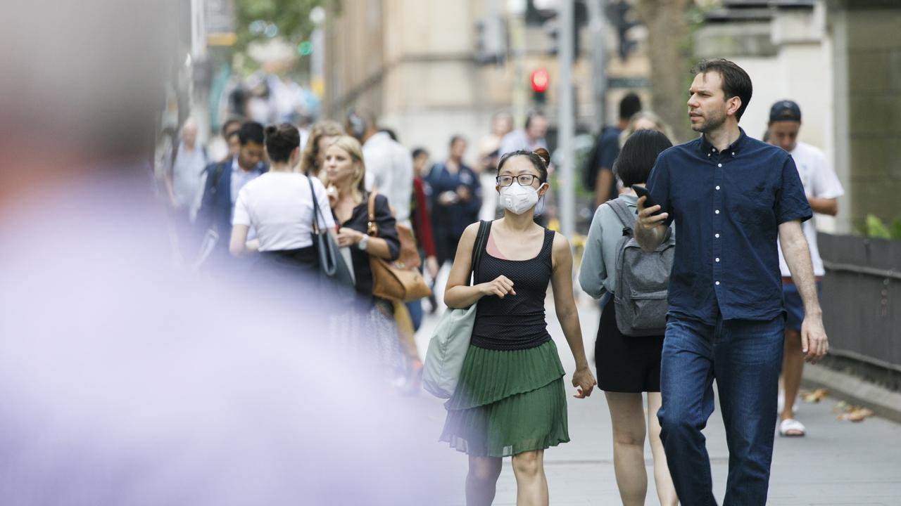 Mask are commonly now being worn around the Sydneys CBD due to the fear of the Coronavirus. Photo: Tim Pascoe