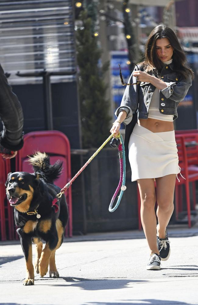 Emily Ratajkowski, 30, stuns in a matching white crop and skirt, showing off her toned figure. Picture: Splash News/ Media Mode