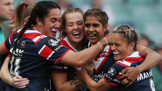 Roosters players celebrate a try by Taleena Simon at Allianz Stadium. Picture: Brett Costello