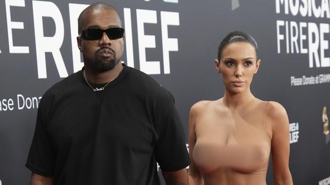 EDS NOTE: NUDITY - Kanye West, left, and Bianca Censori arrive at the 67th annual Grammy Awards on Sunday, Feb. 2, 2025, in Los Angeles. (Photo by Jordan Strauss/Invision/AP)