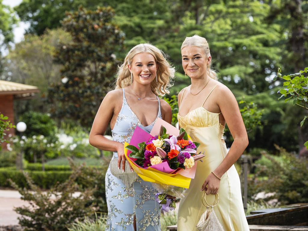 Graduates Mikayla Saunders (left) and Annalise Biggar as Downlands College year 12 students come together for their valedictory mass at the college, Saturday, November 16, 2024. Picture: Kevin Farmer