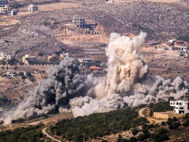 TOPSHOT - Smoke rises from the site of an Israeli airstrike that targeted the outskirts of the southern Lebanese village of Aishiyeh on October 26, 2024, amid the ongoing war between Israel and Hezbollah. (Photo by AFP)