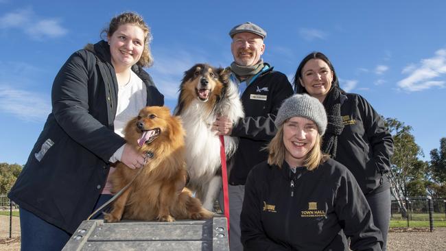 Resident Nicole Bologna with Hachi, Cr Drew Jessop with Shilo, Mayor Carly Moore and Cr Karen Sherry enjoy the new enclosed dog park in Broadmeadows. Picture: Andy Brownbill