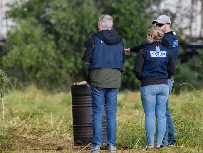 Police search through trees in a vacant paddock on Cheviot Rd in Salisbury South where a decomposed body was found, 25th October 2022. Picture: Brenton Edwards