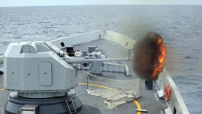 An anti-surface gun is fired from China's Navy missile frigate Yulin during in the South China Sea. Picture: AP