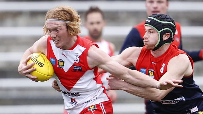 Round 7 TSL match between North Hobart v Clarence from North Hobart Oval. Clarence's Ethan Jackson is tackled by North Hobart's Nathan McCulloch. Picture: Zak Simmonds