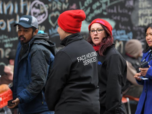 Department of Family and Community Service workers visited Martin Place to offer the homeless housing options. Picture: Simon Bullard