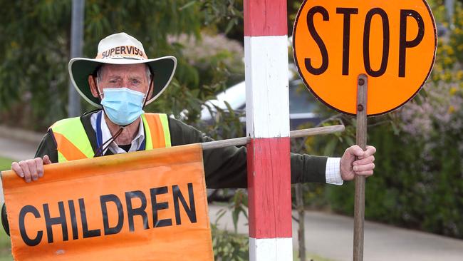 Crossing supervisors have been told not to use whistles during COVID-19, sparking safety fears. Picture: Glenn Ferguson