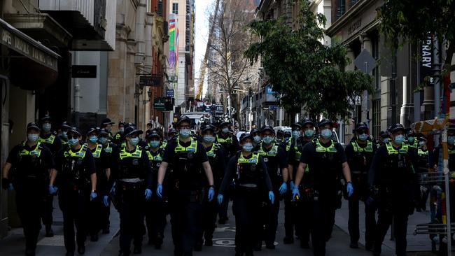 A heavy Victoria Police presence is seen as anti lockdown protesters take to the streets in Melbourne. Picture: Getty Images