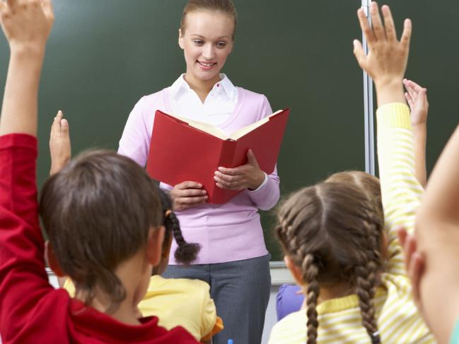 Generic image of teacher teaching students inside school classroom.